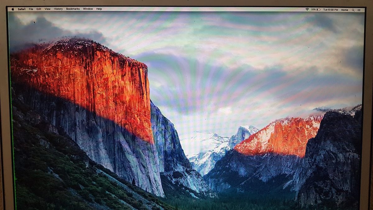 MacBook Pro screen with colour banding and a green vertical line, a display fault